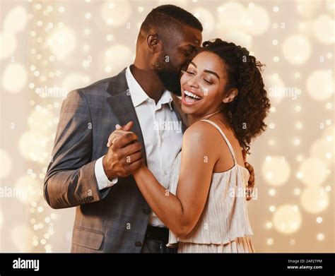 Beautiful Happy Black Couple Dancing In Modern Restaurant Stock Photo
