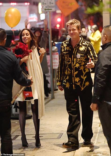 brad pitt celebrates his 60th birthday in a very striking gold suit with his girlfriend ines de