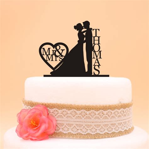 custom wedding bride holding and grooms cake topper last name personalized wedding cake topper