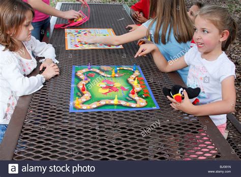 Kids Playing A Board Game Stock Photo Alamy