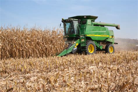 Farmer In A John Deere Combine Harvesting Corn Stock Photo Download