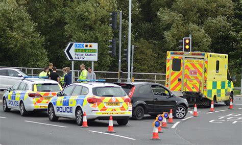 Police And Ambulance At Scene Of Road Traffic Collision Near