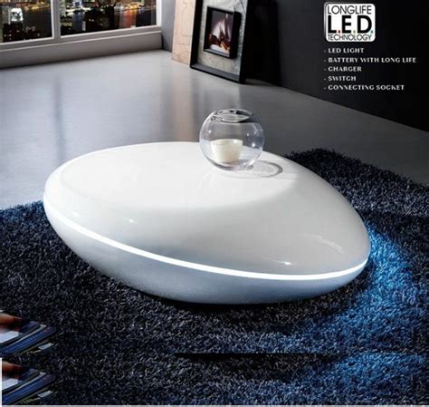 For those in smaller spaces, such as apartments or lofts, opt for a round coffee table that complements the loveseat instead. Milania High Gloss Coffee Table In White With Led Lights