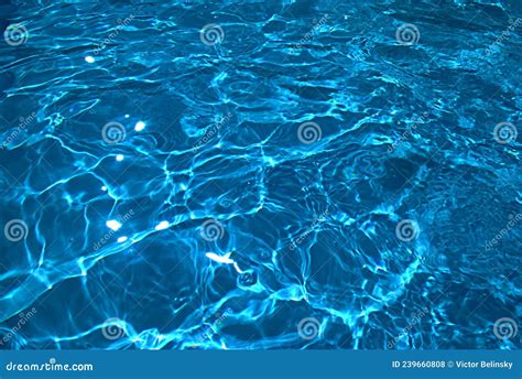 Water Background Blue Sun Glare On The Water Surface Stock Photo