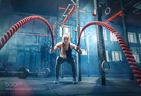 Woman With Battle Ropes Exercise In The Fitness Gym Woman With Battle