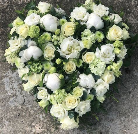 This highly personal type of arrangement is appropriate for a spouse or a member of the immediate family to send to the service, or for parents to send for a child. Funeral flowers - White Rose Modern Funerals