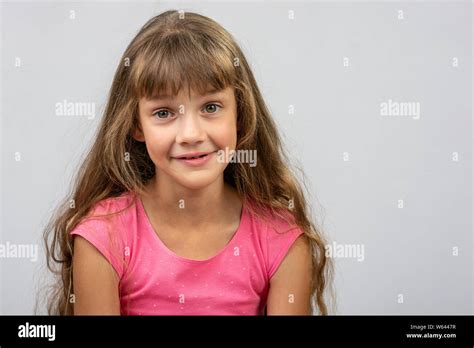 Portrait Of A Surprised Beautiful Eight Year Cheerful European Girl