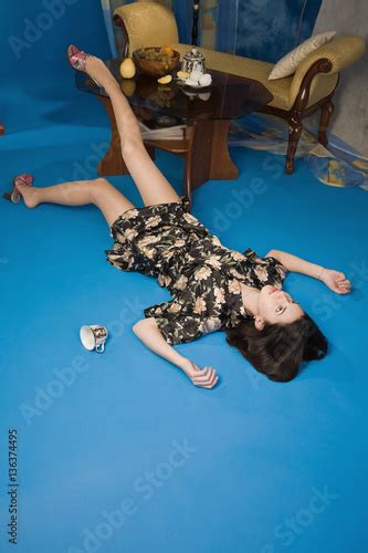 Crime Scene Simulation Poisoned Woman Lying On The Floor Stock Photo