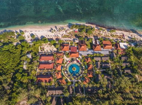 Aerial View Above Of Vacation Resort With Round Pool Near The Beach