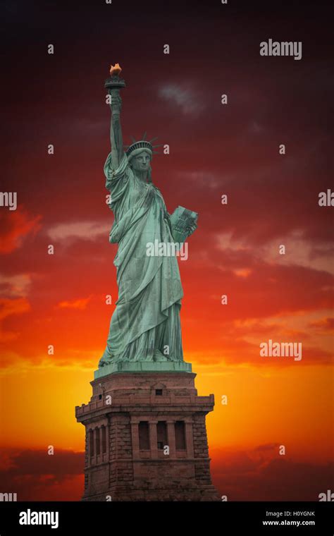 Statue Of Liberty On The Background Of Colorful Dawn Sky Stock Photo