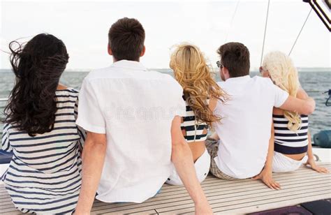 Group Of Friends Sitting On Yacht Deck Stock Photo Image Of Sailors