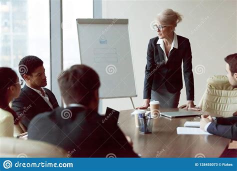 Serious Businesswoman Talk During Company Briefing In Office Stock Image Image Of Middle Give