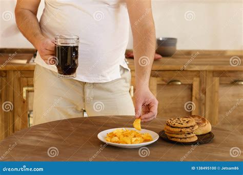 Overweight Man With Unhealthy Junk Food And Beer Stock Photo Image Of