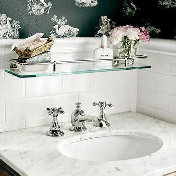 With the simple and modern looking design it will leave an otherwise messy and cluttered countertop looking clean and organized. Glass Shelf over Sink - Traditional - bathroom - Elle Decor