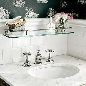 Here's a trick that's as elegant as it is practical: Glass Shelf over Sink - Traditional - bathroom - Elle Decor