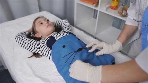 Doctor Examines Young Patients Abdomen In Stock Footage Sbv 337826450 Storyblocks