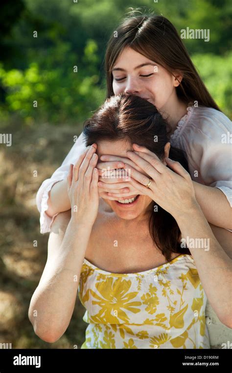 Daughter Covering Mothers Eyes Stock Photo Alamy