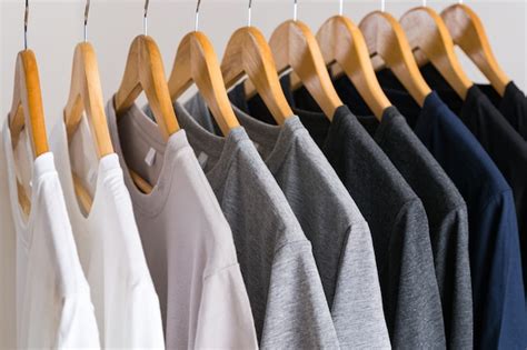 Premium Photo Close Up Of T Shirts On Hangers