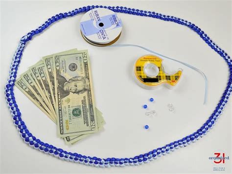 Fold it in half again. Money Lei Tutorial with Ribbon Lei - Organized 31
