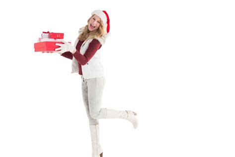 A Montage Of A Cheerful Blonde Woman Wearing Warm Clothes Carrying A Stack Of Presents With A