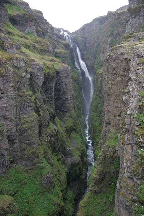 Glymur Tall Waterfall With Rugged Hike Into A Double Arch