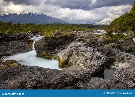 Beautiful Patagonian Waterfall In A Forest Lit By The Rising Sun Of