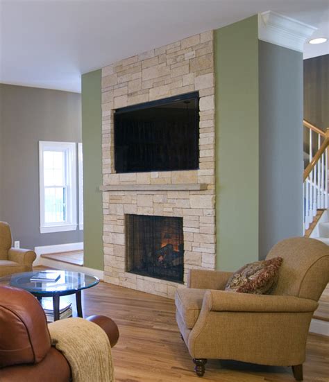 Natural stone fireplaces with wall mount television design ideas we have observed that the trend of placing the flat screen television above a natural stone fireplaces is catching on like wildfire indeed! Stone Veneer Fireplace & TV Niche - Contemporary - Family ...