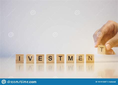 Hands Putting Wooden Cube Text For Investment Word Stock Image Image