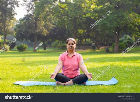 Indian Woman Doing Breathing Yoga Exercise Stock Photo 2216731411