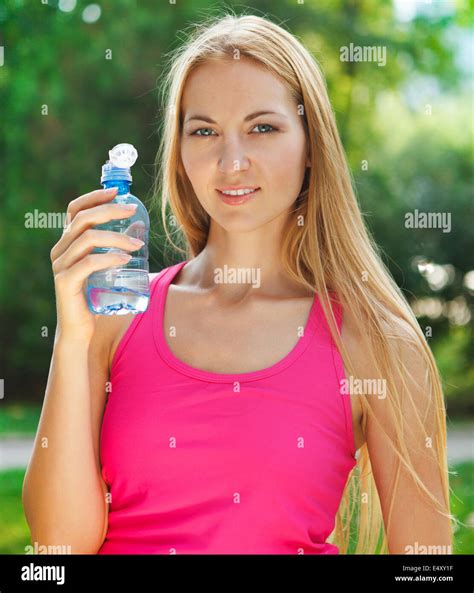 Woman Drinking Water After Fitness Exercise Stock Photo Alamy