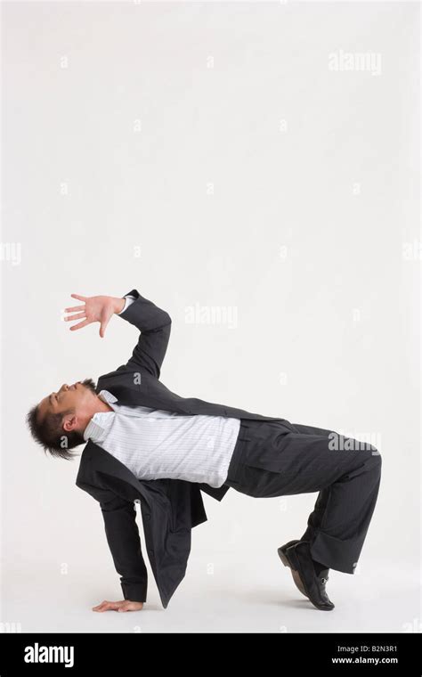 Side Profile Of A Businessman Bending Over Backwards Stock Photo Alamy