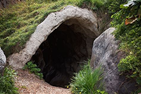 Hd Wallpaper Gray Stone Tunnel Surrounded By Grass Field Cave In