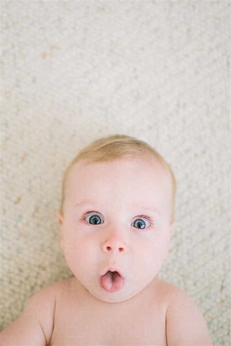 Closeup Of Baby Making Funny Face At The Camera Stock Photo