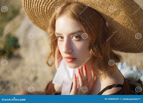 Portrait Of Sweet Blonde Girl In Straw Hat Posing On A Background Of The City Stock Image