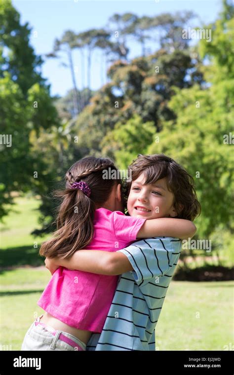 Little Siblings Hugging Each Other Stock Photo Alamy