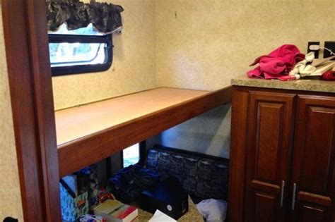 switch an rv bunk bed into a storage shelf for almost anything