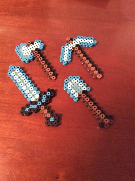 Get yourself a diamond tool set without the search for diamonds! Minecraft diamond tools perler beads by zlink88 on ...