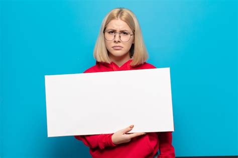 premium photo blonde woman feeling sad and whiney with an unhappy look crying with a negative