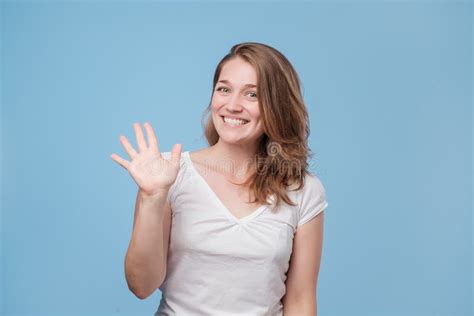 Woman Smiling Happily Saying Hello Hi Or Bye Stock Image Image Of
