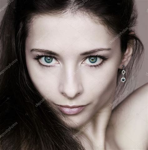Closeup Portrait Of Beautiful Woman With Sexy Green Eyes Looking