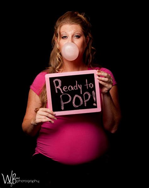 A Pregnant Woman Blowing Bubbles While Holding A Sign That Reads Ready To Pop On It