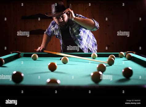 A Man With A Beard Plays A Big Billiard Party In 12 Foot Pool Billiards In The Club Game For