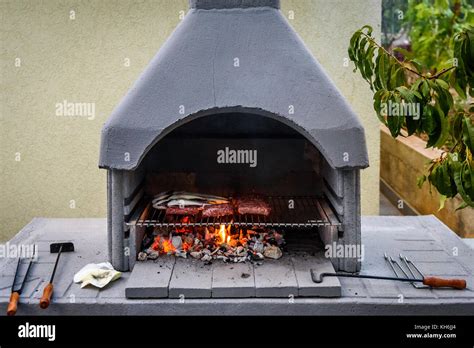 Barbecue In Built Barbecue Grill Fireplace With Fish And Chevaps