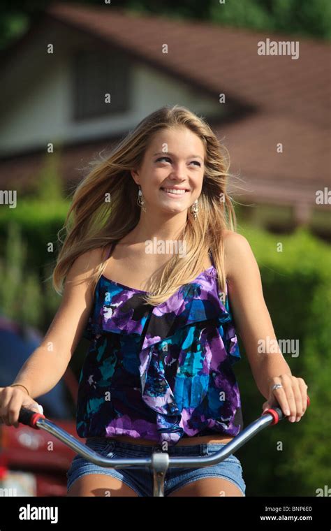 Pretty Blondteenage Girl Rides Her Bicycle Stock Photo Alamy