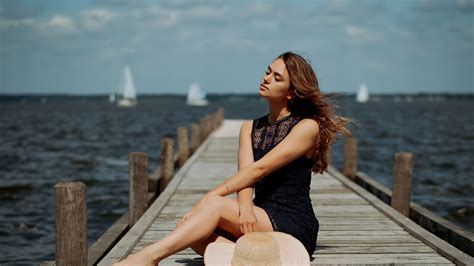 2560x1440 Girl Sitting On Pier Side Depth Of Field 1440p Resolution Hd