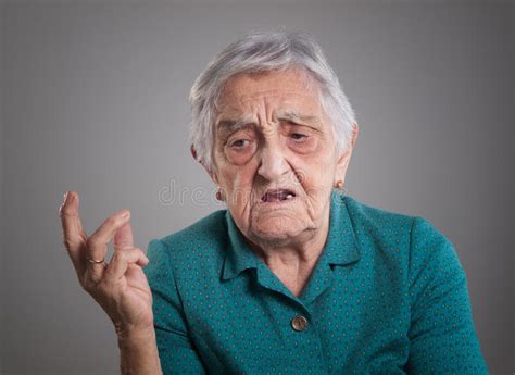 Angry Elderly Woman Threatening Someone With Raised Fists Stock Image