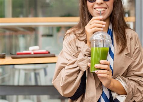 Free Photo Happy Woman Drinking Green Smoothie