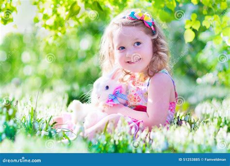 Little Girl Playing With A Rabbit Stock Image Image Of Love Flower