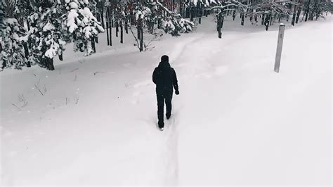 Lone Man Walking Through Snow Stock Video Motion Array