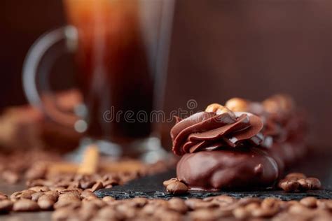 Chocolate Dessert With Hazelnut And Coffee With Cream On A Wood Stock